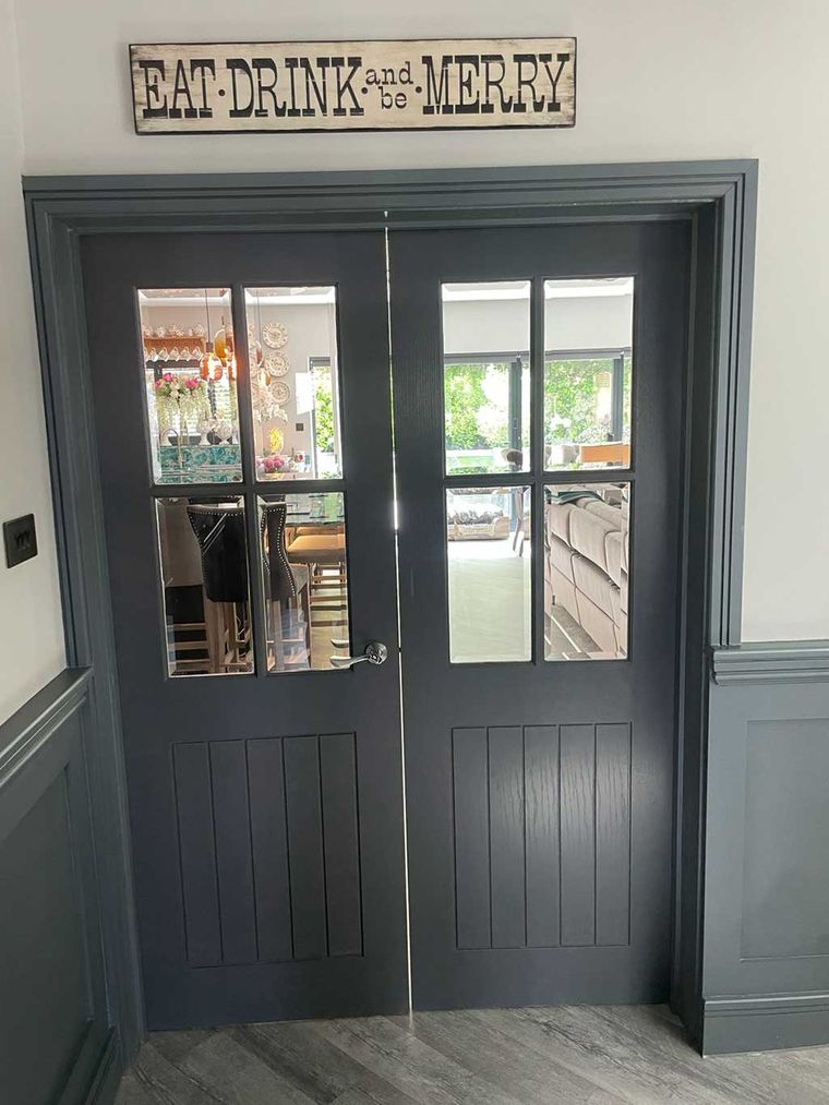 Glazed internal double doors between the dining and living rooms