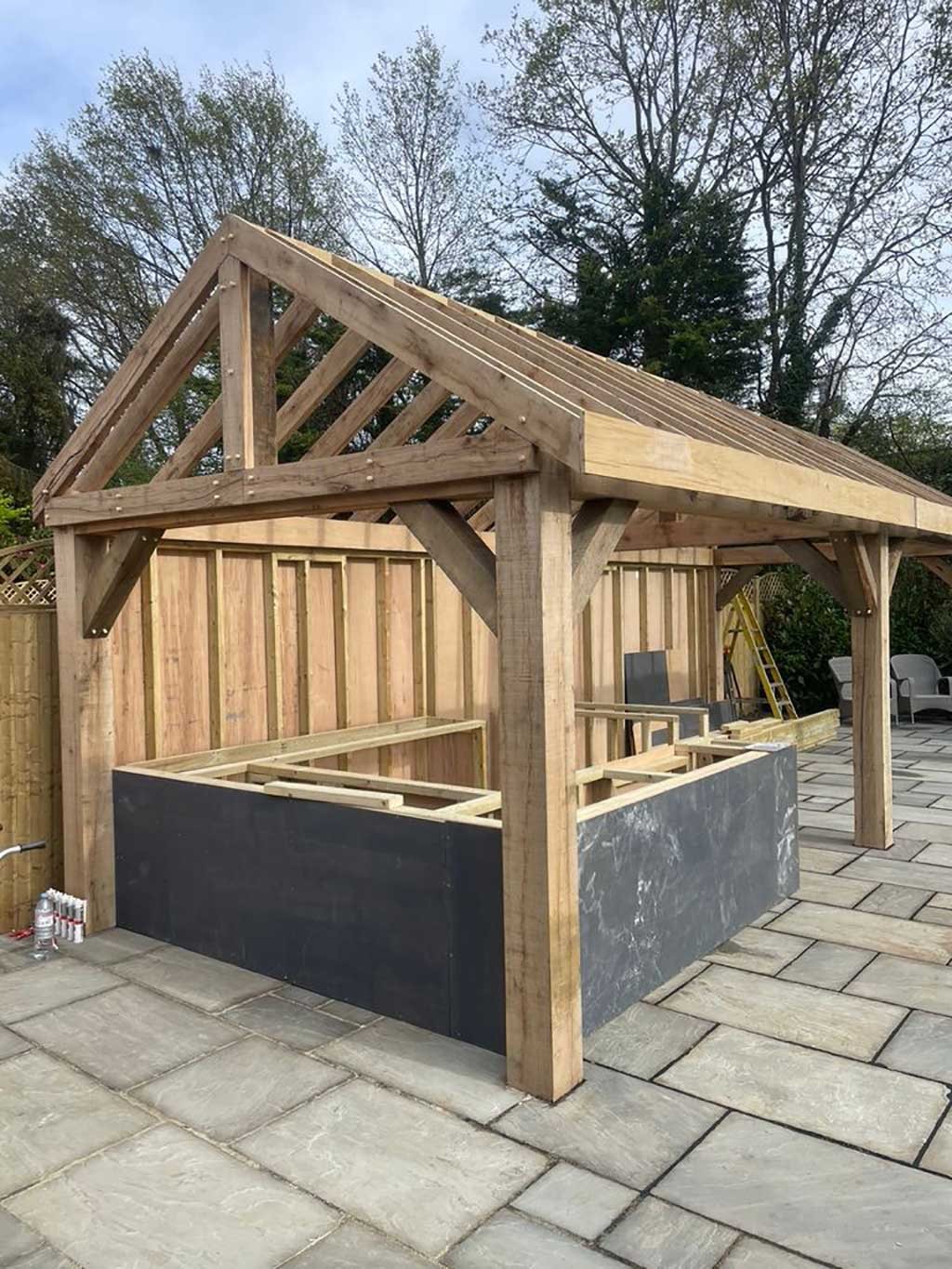 Oak framed garden room under construction with timber trusses